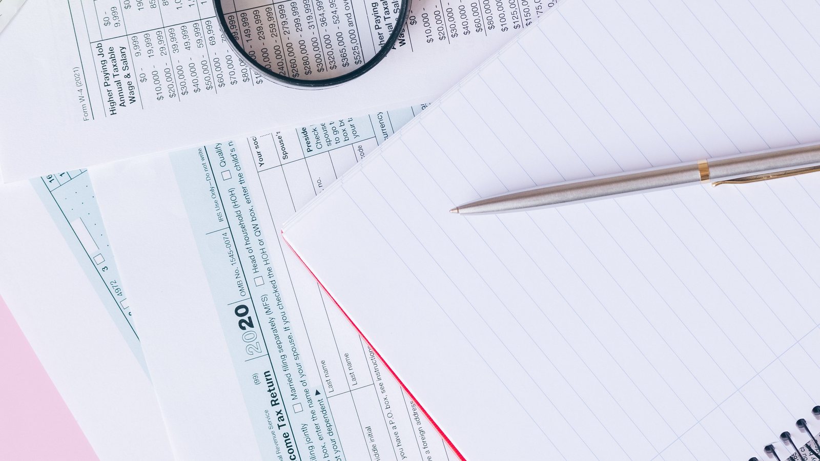 Tax forms and calculator representing Maryland nonresident seller withholding rules for 2026 real estate sales