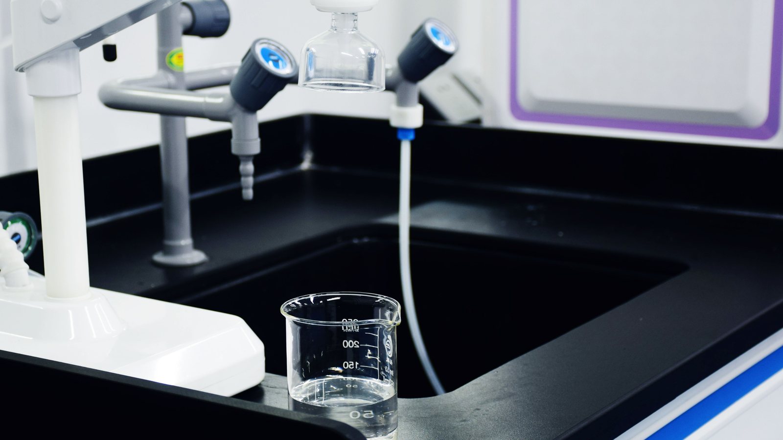 Laboratory water sample representing private well water testing for Calvert County Maryland homebuyers