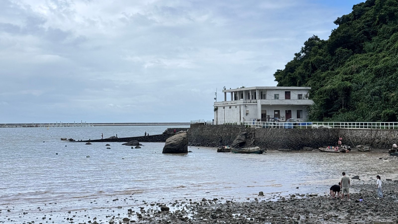 Rocky protected shoreline and waterfront home representing Calvert County shoreline stabilization records