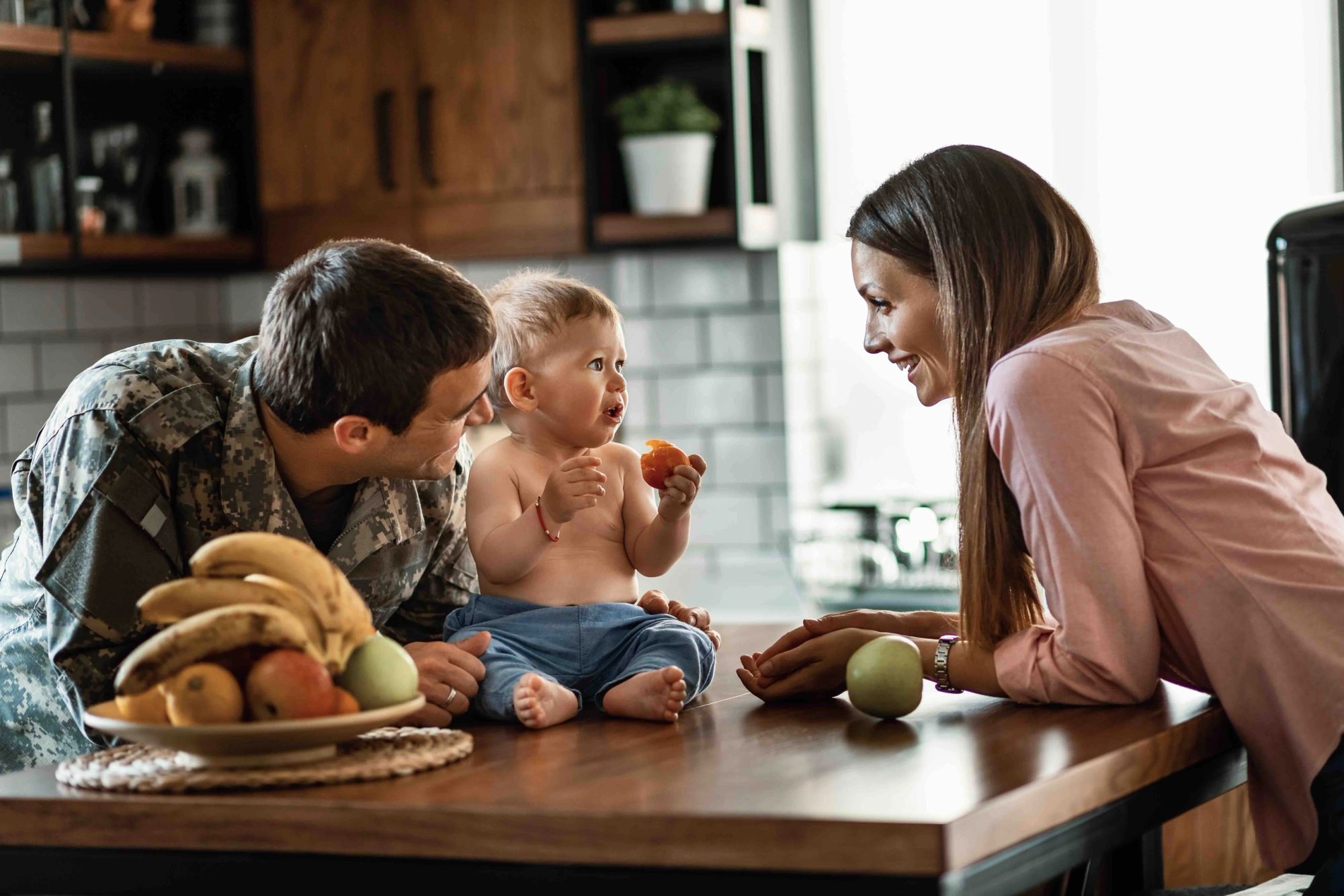 Military family at home together after buying a house near their duty station